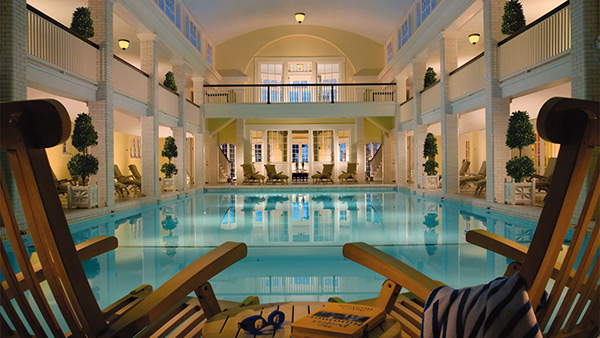 Bedford Springs Resort, Pennsylvania - opulent azure pool in two-story room with white pillars